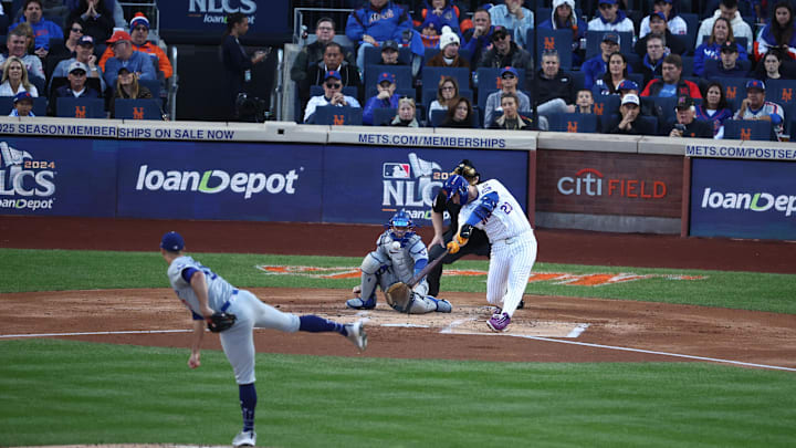 Oct 18, 2024; New York City, New York, USA; New York Mets first baseman Pete Alonso (20) hits a three run home run off Los Angeles Dodgers pitcher Jack Flaherty (0) during the first inning during game five of the NLCS for the 2024 MLB playoffs at Citi Field. Mandatory Credit: Wendell Cruz-Imagn Images