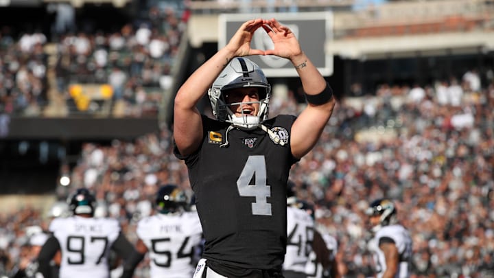 Dec 15, 2019; Oakland, CA, USA; Oakland Raiders quarterback Derek Carr (4) reacts after throwing a touchdown pass against the Jacksonville Jaguars in the first quarter at Oakland Coliseum. Mandatory Credit: Cary Edmondson-Imagn Images