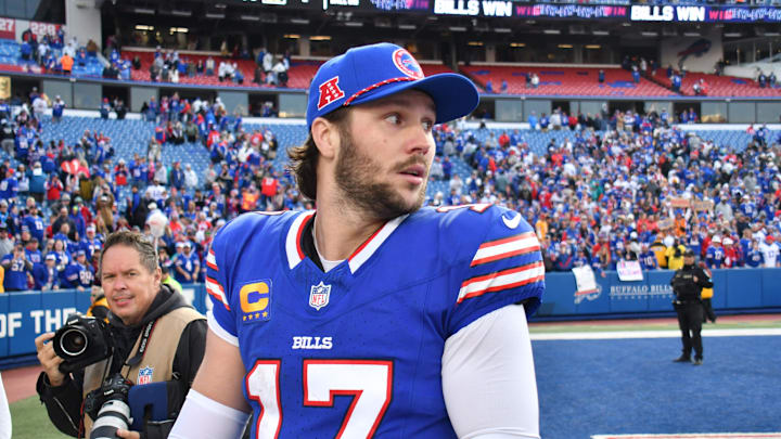 Buffalo Bills quarterback Josh Allen (17) leaves the field after a win against the Miami Dolphins at Highmark Stadium. 