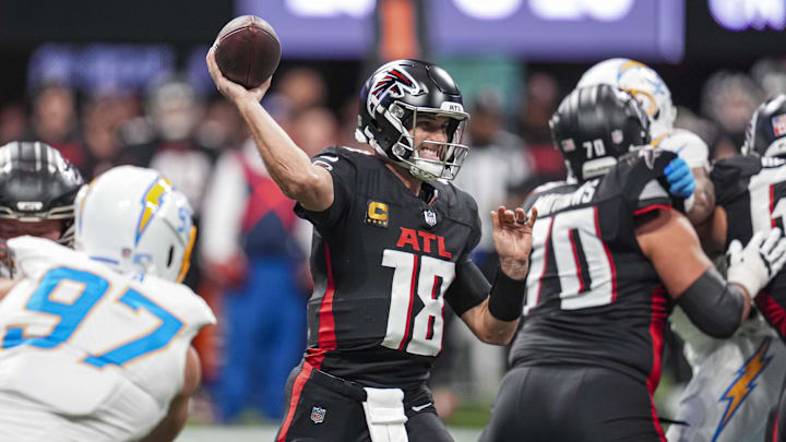Dec 1, 2024; Atlanta, Georgia, USA; Atlanta Falcons quarterback Kirk Cousins (18) passes against the Los Angeles Chargers during the first half at Mercedes-Benz Stadium. Mandatory Credit: Dale Zanine-Imagn Images