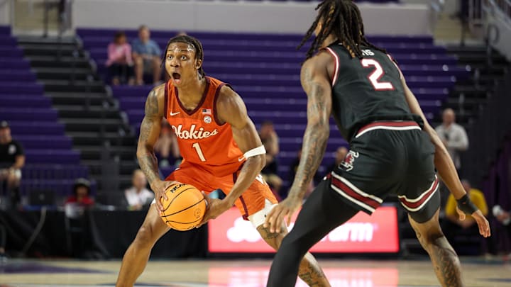 Nov 27, 2024; Fort Myers, Florida, USA; Virginia Tech Hokies forward Toibu Lawal (1) looks to pass the ball against the South Carolina Gamecocks in the first half at Suncoast Credit Union Arena. Mandatory Credit: Nathan Ray Seebeck-Imagn Images
