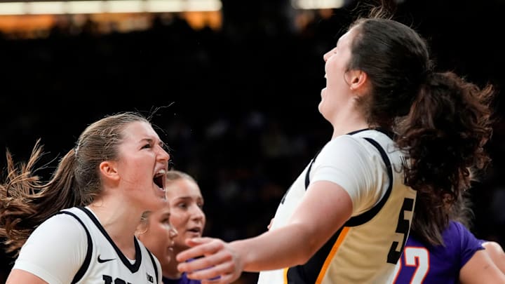 Iowa guard Taylor Stremlow (1) and Iowa center Ava Heiden (5) react Nov. 9, 2025 during a women’s basketball game against the Evansville Purple Aces at Carver-Hawkeye Arena in Iowa City, Iowa.