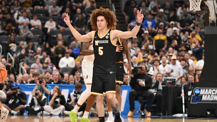 Mar 20, 2026; St. Louis, MO, USA; Missouri Tigers guard T.O. Barrett (5) reacts after a play during the second half against the Miami (FL) Hurricanes during a first round game of the men's 2026 NCAA Tournament at Enterprise Center. Mandatory Credit: Jeff Curry-Imagn Images