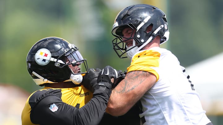 Jul 24, 2025; Latrobe, PA, USA; Pittsburgh Steelers linebacker Jeremiah Moon (left) works against /offensive tackle Doug Nester (right) during training camp at Saint Vincent College. Mandatory Credit: Charles LeClaire-Imagn Images Jul 24, 2025; Latrobe, PA, USA; Pittsburgh Steelers linebacker Jeremiah Moon (left) works against /offensive tackle Doug Nester (right) during training camp at Saint Vincent College. Mandatory Credit: Charles LeClaire-Imagn Images