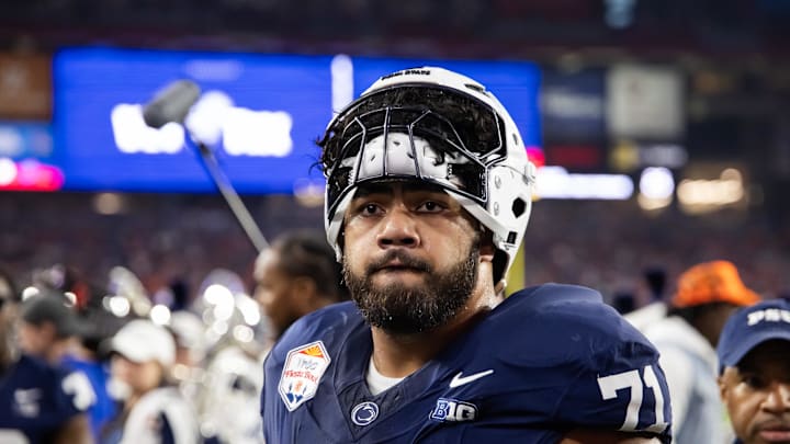 Dec 31, 2024; Glendale, AZ, USA; Penn State Nittany Lions offensive lineman Olaivavega Ioane (71) against the Boise State Broncos during the Fiesta Bowl at State Farm Stadium. 