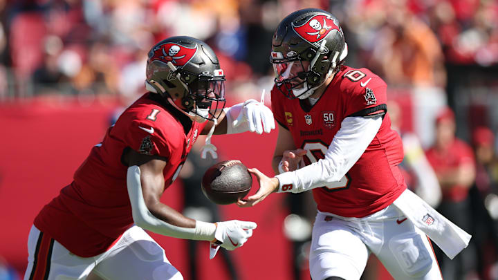 Nov 30, 2025; Tampa, Florida, USA; Tampa Bay Buccaneers quarterback Baker Mayfield (6) hands off to running back Rachaad White (1) during the first half against the Arizona Cardinals at Raymond James Stadium. Mandatory Credit: Nathan Ray Seebeck-Imagn Images Nov 30, 2025; Tampa, Florida, USA; Tampa Bay Buccaneers quarterback Baker Mayfield (6) hands off to running back Rachaad White (1) during the first half against the Arizona Cardinals at Raymond James Stadium. Mandatory Credit: Nathan Ray Seebeck-Imagn Images