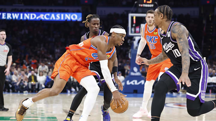 Feb 1, 2025; Oklahoma City, Oklahoma, USA; Oklahoma City Thunder guard Shai Gilgeous-Alexander (2) moves the ball down the court against Sacramento Kings forward DeMar DeRozan (10) during the second half at Paycom Center. Mandatory Credit: Alonzo Adams-Imagn Images Feb 1, 2025; Oklahoma City, Oklahoma, USA; Oklahoma City Thunder guard Shai Gilgeous-Alexander (2) moves the ball down the court against Sacramento Kings forward DeMar DeRozan (10) during the second half at Paycom Center. Mandatory Credit: Alonzo Adams-Imagn Images