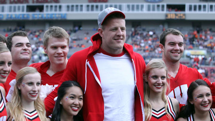 Jan 1, 2015; Tampa, FL, USA; Houston Texans defensive end J.J. Watt  posses for a picture with the Wisconsin Badgers cheerleaders prior to the game in the 2015 Outback Bowl against the Auburn Tigers at Raymond James Stadium.