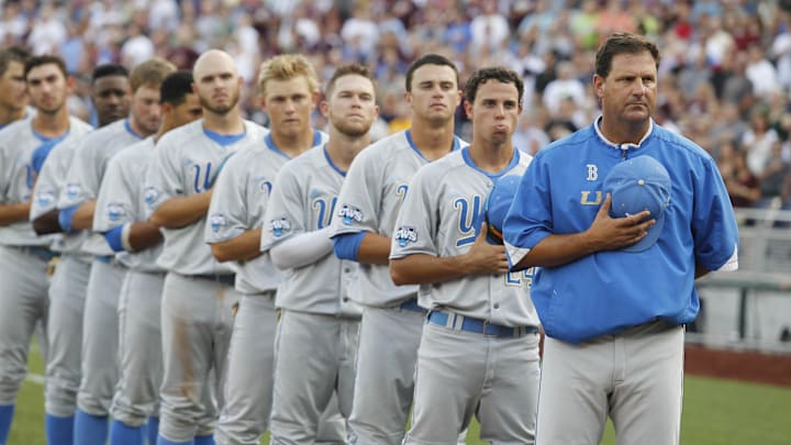 Jun 24, 2013; Omaha, NE, USA; UCLA Bruins head coach John Savage (far right) stands on the foul line with his team during the national anthem before game 1 of the College World Series finals against the Mississippi State Bulldogs at TD Ameritrade Park. Mandatory Credit: Bruce Thorson-Imagn Images Jun 24, 2013; Omaha, NE, USA; UCLA Bruins head coach John Savage (far right) stands on the foul line with his team during the national anthem before game 1 of the College World Series finals against the Mississippi State Bulldogs at TD Ameritrade Park. Mandatory Credit: Bruce Thorson-Imagn Images