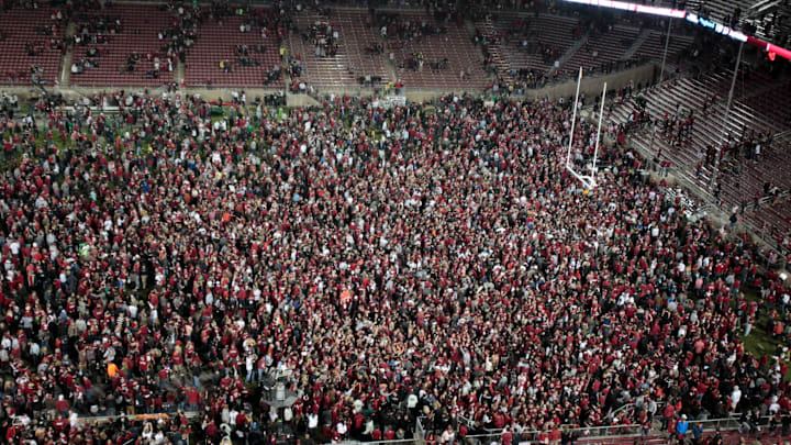 Nov 7, 2013; Stanford, CA, USA; Stanford Cardinal fans rush the field after the win against the Oregon Ducks at Stanford Stadium. The Stanford Cardinal defeated the Oregon Ducks 26-20. Mandatory Credit: Kelley L Cox-Imagn Images