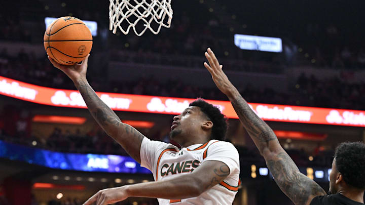 Feb 8, 2025; Louisville, Kentucky, USA; Miami (Fl) Hurricanes forward Brandon Johnson (2) shoots against Louisville Cardinals forward James Scott (0) during the first half at KFC Yum! Center. Mandatory Credit: Jamie Rhodes-Imagn Images Feb 8, 2025; Louisville, Kentucky, USA; Miami (Fl) Hurricanes forward Brandon Johnson (2) shoots against Louisville Cardinals forward James Scott (0) during the first half at KFC Yum! Center. Mandatory Credit: Jamie Rhodes-Imagn Images