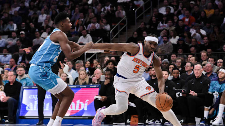 Dec 5, 2024; New York, New York, USA; New York Knicks forward Precious Achiuwa (5) brings the ball up court while being defended by Charlotte Hornets forward Brandon Miller (24) during the second half at Madison Square Garden. Mandatory Credit: John Jones-Imagn Images Dec 5, 2024; New York, New York, USA; New York Knicks forward Precious Achiuwa (5) brings the ball up court while being defended by Charlotte Hornets forward Brandon Miller (24) during the second half at Madison Square Garden. Mandatory Credit: John Jones-Imagn Images
