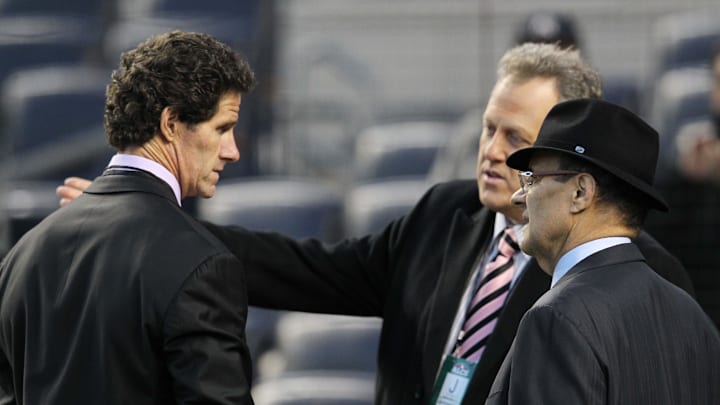 MLB vice president of baseball operations Joe Torre (right) talks with New York Yankees former player Paul O'Neill (left) and broadcaster Michael Kay before game one of the 2012 ALCS against the Detroit Tigers at Yankee Stadium.  