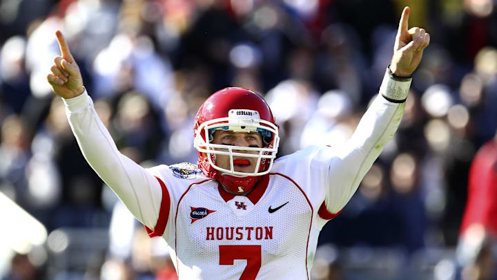 Jan 02, 2012; Dallas, TX, USA; Houston Cougars quarterback Case Keenum (7) celebrates after throwing a touchdown pass against the Penn State Nittany Lions during the second quarter of the 2012 Ticket City Bowl at Cotton Bowl Stadium.  Mandatory Credit: Kevin Jairaj-Imagn Images