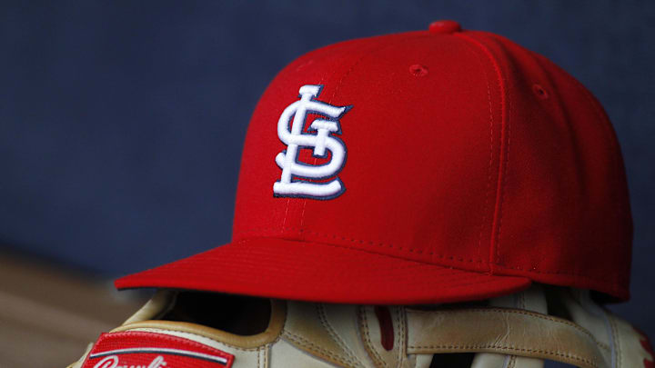 Oct 4, 2015; Atlanta, GA, USA; Detailed view of St. Louis Cardinals hat and glove in the dugout against the Atlanta Braves in the ninth inning at Turner Field. The Braves defeated the Cardinals 2-0. Mandatory Credit: Brett Davis-Imagn Images Oct 4, 2015; Atlanta, GA, USA; Detailed view of St. Louis Cardinals hat and glove in the dugout against the Atlanta Braves in the ninth inning at Turner Field. The Braves defeated the Cardinals 2-0. Mandatory Credit: Brett Davis-Imagn Images