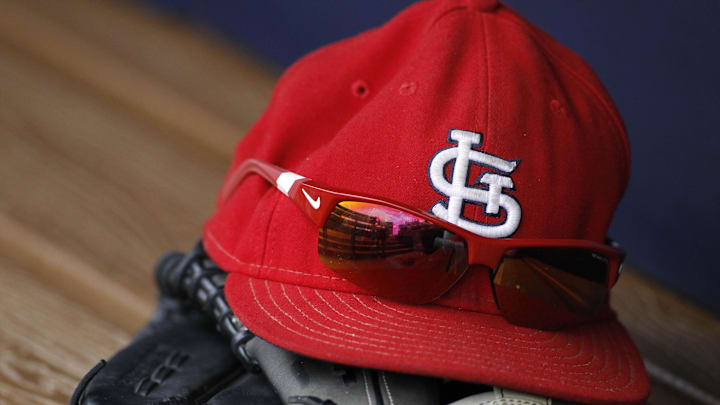 Jul 27, 2013; Atlanta, GA, USA; Detailed view of St. Louis Cardinals cap and glove in the dugout before a game against the Atlanta Braves at Turner Field. Mandatory Credit: Brett Davis-Imagn Images