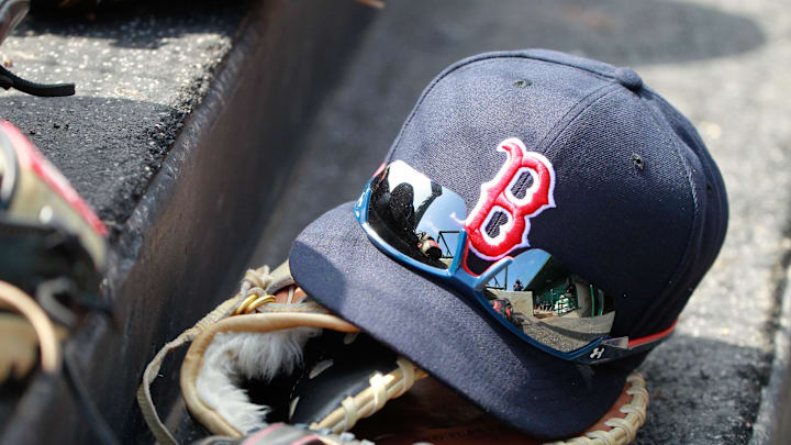 Mar 7, 2015; Sarasota, FL, USA; A general view of Boston Red Sox hat and glove laying in the dugout at a spring training baseball game at Ed Smith Stadium. Mandatory Credit: Kim Klement-Imagn Images Mar 7, 2015; Sarasota, FL, USA; A general view of Boston Red Sox hat and glove laying in the dugout at a spring training baseball game at Ed Smith Stadium. Mandatory Credit: Kim Klement-Imagn Images