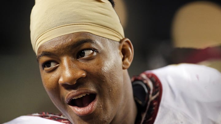Sep 2, 2013; Pittsburgh, PA, USA; Florida State Seminoles quarterback Jameis Winston (5) reacts on the sidelines against the Pittsburgh Panthers during the fourth quarter at Heinz Field. The Florida State Seminoles won 41-13. Mandatory Credit: Charles LeClaire-Imagn Images