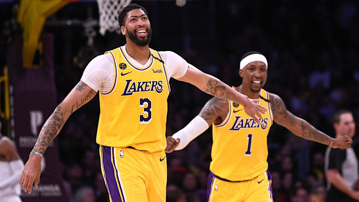Los Angeles Lakers forward Anthony Davis (3) and guard Kentavious Caldwell-Pope (1) react during the fourth quarter against the Memphis Grizzlies at Staples Center.