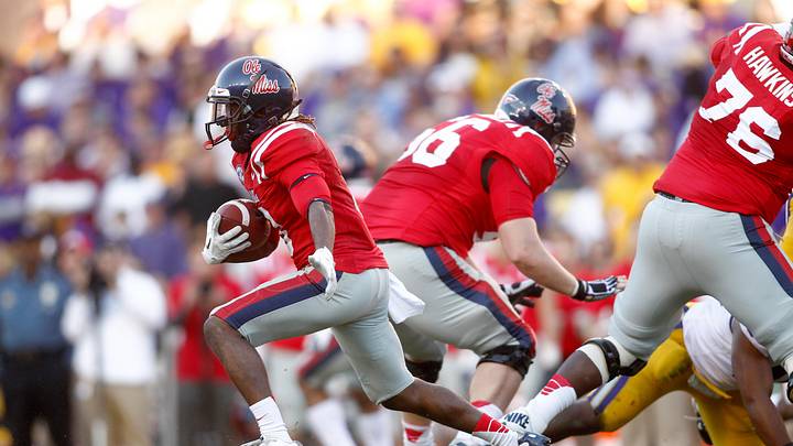 Ole Miss Rebels running back Jeff Scott carries the ball against the LSU Tigers during the first half at Tiger Stadium. Ole Miss Rebels running back Jeff Scott carries the ball against the LSU Tigers during the first half at Tiger Stadium.