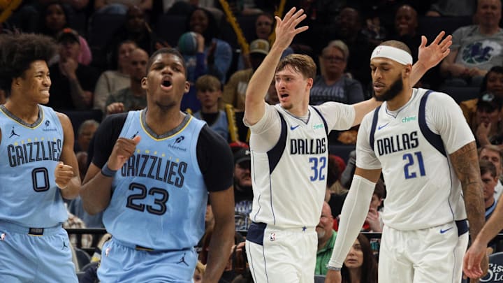 Nov 7, 2025; Memphis, Tennessee, USA; Dallas Mavericks forward Cooper Flagg (32) and Memphis Grizzlies forward Cedric Coward (23) react during the second quarter against the Memphis Grizzlies at FedExForum. Mandatory Credit: Petre Thomas-Imagn Images