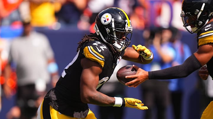 Sep 15, 2024; Denver, Colorado, USA; Pittsburgh Steelers quarterback Justin Fields (2) hands off to running back Najee Harris (22) in the first quarter against the Denver Broncos at Empower Field at Mile High. Mandatory Credit: Ron Chenoy-Imagn Images