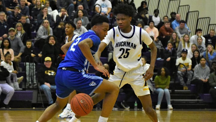 Father Tolton's Exavier Wilson (2) tries to dribble around Hickman's Rasaun Nichols (25) during Tolton's 66-60 win over the Kewpies on January 11, 2023, at Hickman High School.

Dsc 0973 2