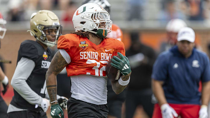 Jan 30, 2025; Mobile, AL, USA; National team running back Damien Martinez of Miami (32) works through drills during Senior Bowl practice for the National team at Hancock Whitney Stadium. Mandatory Credit: Vasha Hunt-Imagn Images