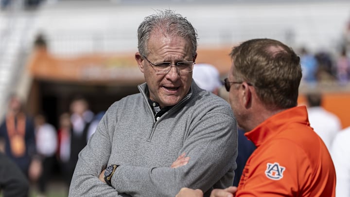 Jan 29, 2025; Mobile, AL, USA; Florida State offensive coordinator Gus Malzahn talks with Auburn head coach Hugh Freeze during Senior Bowl practice for the American team at Hancock Whitney Stadium. Malzahn is a former Auburn football head coach. Mandatory Credit: Vasha Hunt-Imagn Images