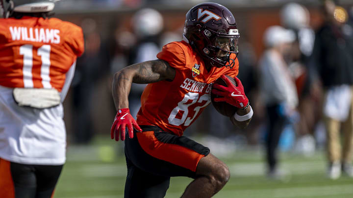 Jan 28, 2025; Mobile, AL, USA; National team wide receiver Jaylin Lane of Virginia Tech (83) runs the ball during Senior Bowl practice for the National team at Hancock Whitney Stadium. Mandatory Credit: Vasha Hunt-Imagn Images