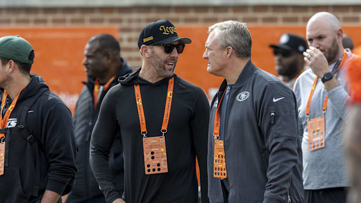 Jan 28, 2025; Mobile, AL, USA; Washington Commanders general manger Adam Peters reunites with former boss John Lynch during Senior Bowl practice for the American team at Hancock Whitney Stadium. Lynch is the general manager of the San Francisco 49ers. Mandatory Credit: Vasha Hunt-Imagn Images