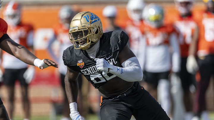 Jan 29, 2025; Mobile, AL, USA; National team defensive lineman Oluwafemi Oladejo of UCLA (99) runs through a drill during Senior Bowl practice at Hancock Whitney Stadium. Mandatory Credit: Vasha Hunt-Imagn Images Jan 29, 2025; Mobile, AL, USA; National team defensive lineman Oluwafemi Oladejo of UCLA (99) runs through a drill during Senior Bowl practice at Hancock Whitney Stadium. Mandatory Credit: Vasha Hunt-Imagn Images