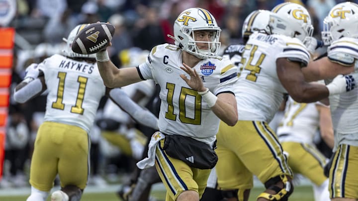 Dec 27, 2024; Birmingham, AL, USA;  Georgia Tech Yellow Jackets quarterback Haynes King (10) throws the ball on the run against the Vanderbilt Commodores during the first half of the 2024 Birmingham Bowl at Protective Stadium. Mandatory Credit: Vasha Hunt-Imagn Images