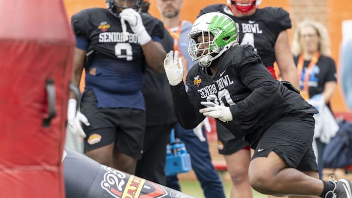 Jan 30, 2025; Mobile, AL, USA; National team defensive lineman Jamaree Caldwell of Oregon (90) works through drills during Senior Bowl practice for the National team at Hancock Whitney Stadium. Mandatory Credit: Vasha Hunt-Imagn Images
