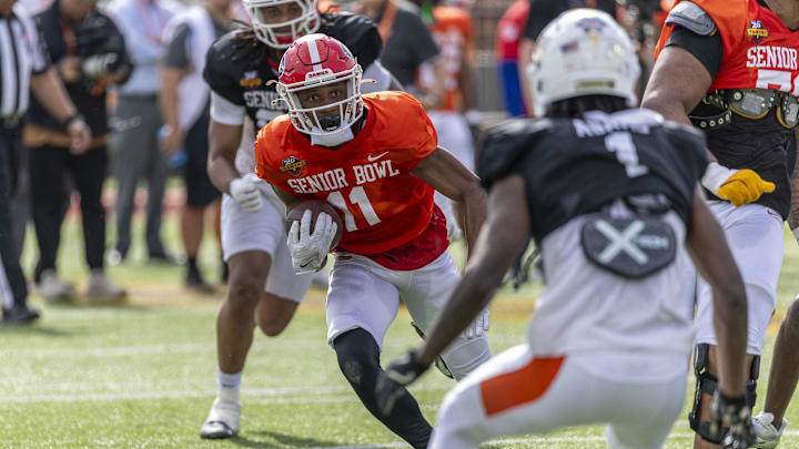 Jan 29, 2025; Mobile, AL, USA; American team wide receiver Arian Smith of Georgia (11) runs the ball during Senior Bowl practice for the American team at Hancock Whitney Stadium. Mandatory Credit: Vasha Hunt-Imagn Images