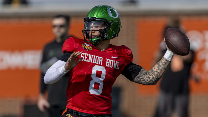 Jan 28, 2025; Mobile, AL, USA; National team quarterback Dillon Gabriel of Oregon (8) throws the ball during Senior Bowl practice for the National team at Hancock Whitney Stadium. Mandatory Credit: Vasha Hunt-Imagn Images