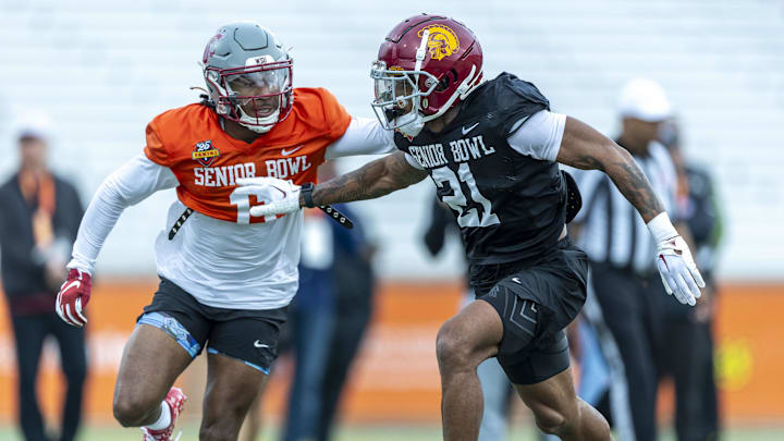 Jan 30, 2025; Mobile, AL, USA; National team wide receiver Kyle Williams of Washington State (11) and National team defensive back Jaylin Smith of USC (21) spar during Senior Bowl practice for the National team at Hancock Whitney Stadium. Jan 30, 2025; Mobile, AL, USA; National team wide receiver Kyle Williams of Washington State (11) and National team defensive back Jaylin Smith of USC (21) spar during Senior Bowl practice for the National team at Hancock Whitney Stadium.