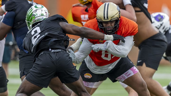 Jan 30, 2025; Mobile, AL, USA; Offensive lineman Marcus Mbow of Purdue University (pictured right) lands a block during Senior Bowl practice at Hancock Whitney Stadium. Mandatory Credit: Vasha Hunt-Imagn Images