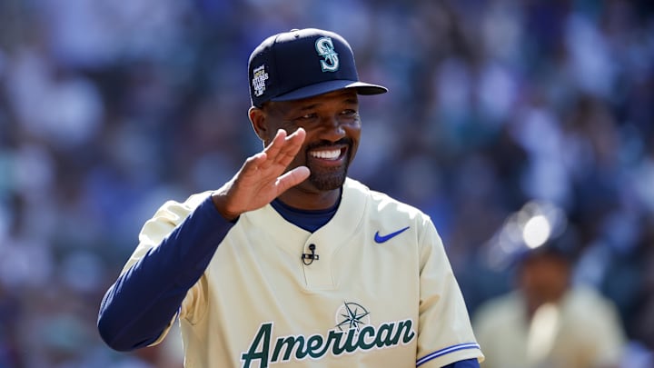 American League Futures manager Harold Reynolds high-fives a player following the third inning of the All Star-Futures Game at T-Mobile Park in 2023.