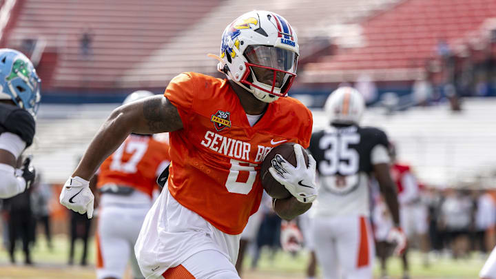 Jan 30, 2025; Mobile, AL, USA; American team running back Devin Neal of Kansas (6) works through drills during Senior Bowl practice for the American team at Hancock Whitney Stadium. 
