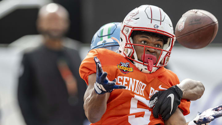 Jan 30, 2025; Mobile, AL, USA; American team wide receiver Jamaal Pritchett of South Alabama (5) grabs a pass with tight defense from American team defensive back Caleb Ransaw of Tulane (13) during Senior Bowl practice for the American team at Hancock Whitney Stadium. Mandatory Credit: Vasha Hunt-Imagn Images Jan 30, 2025; Mobile, AL, USA; American team wide receiver Jamaal Pritchett of South Alabama (5) grabs a pass with tight defense from American team defensive back Caleb Ransaw of Tulane (13) during Senior Bowl practice for the American team at Hancock Whitney Stadium. Mandatory Credit: Vasha Hunt-Imagn Images
