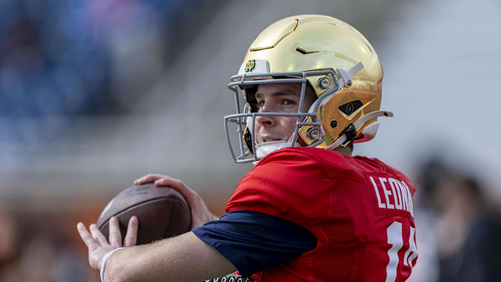 Jan 28, 2025; Mobile, AL, USA; American team quarterback Riley Leonard of Notre Dame (13) throws the ball during Senior Bowl practice for the American team at Hancock Whitney Stadium. Mandatory Credit: Vasha Hunt-Imagn Images