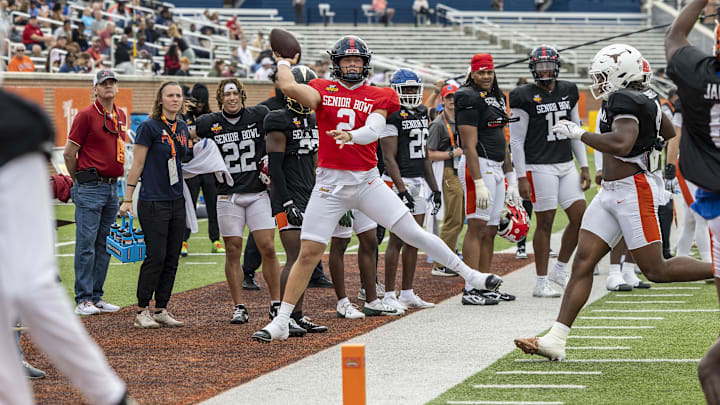Jan 30, 2025; Mobile, AL, USA; American team quarterback Jaxson Dart of Ole Miss (2) throws the ball on the run during Senior Bowl practice for the American team at Hancock Whitney Stadium. Mandatory Credit: Vasha Hunt-Imagn Images
