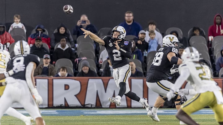 Dec 27, 2024; Birmingham, AL, USA;  Vanderbilt Commodores quarterback Diego Pavia (2) throws the ball on the run against the Georgia Tech Yellow Jackets during the second half of the 2024 Birmingham Bowl at Protective Stadium. Mandatory Credit: Vasha Hunt-Imagn Images