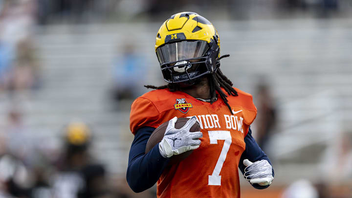 Jan 30, 2025; Mobile, AL, USA; National team running back Donovan Edwards of Michigan (7) works through drills during Senior Bowl practice for the National team at Hancock Whitney Stadium. Mandatory Credit: Vasha Hunt-Imagn Images