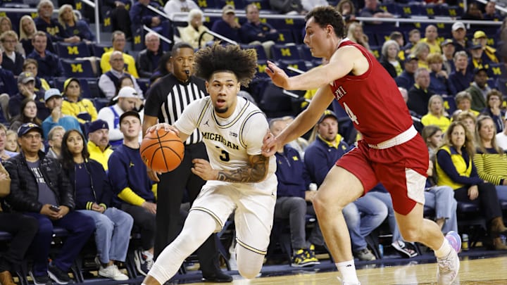 Nov 18, 2024; Ann Arbor, Michigan, USA;  Michigan Wolverines guard Tre Donaldson (3) dribbles defended by Miami (Oh) Redhawks forward Kam Craft (4) in the first half at Crisler Center. Mandatory Credit: Rick Osentoski-Imagn Images