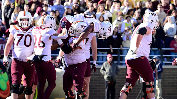 Nov 11, 2023; Chestnut Hill, Massachusetts, USA; Virginia Tech Hokies offensive lineman Kaden Moore (68) celebrates a touchdown by running back Bhayshul Tuten (33) by lifting him onto his shoulders during the first half at Alumni Stadium. Mandatory Credit: Eric Canha-USA TODAY Sports