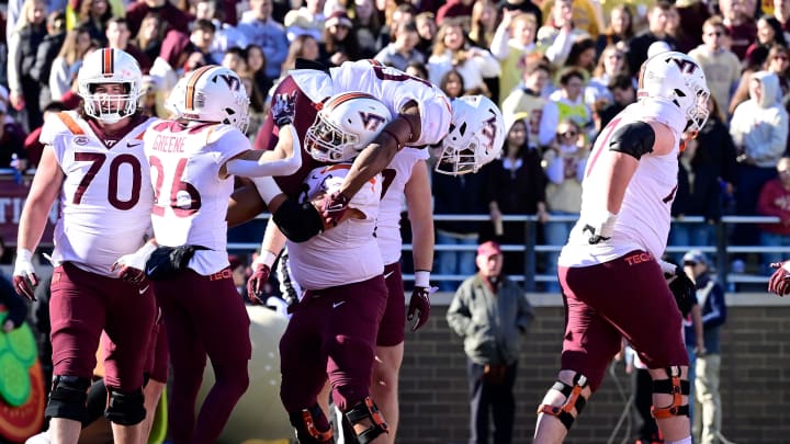 Nov 11, 2023; Chestnut Hill, Massachusetts, USA; Virginia Tech Hokies offensive lineman Kaden Moore (68) celebrates a touchdown by running back Bhayshul Tuten (33) by lifting him onto his shoulders during the first half at Alumni Stadium. Mandatory Credit: Eric Canha-USA TODAY Sports Nov 11, 2023; Chestnut Hill, Massachusetts, USA; Virginia Tech Hokies offensive lineman Kaden Moore (68) celebrates a touchdown by running back Bhayshul Tuten (33) by lifting him onto his shoulders during the first half at Alumni Stadium. Mandatory Credit: Eric Canha-USA TODAY Sports