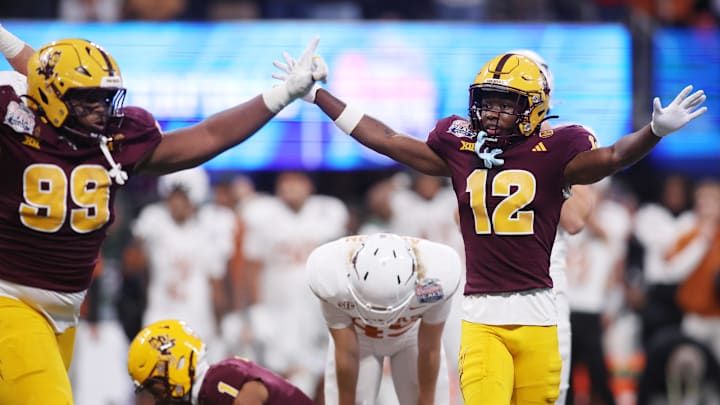Jan 1, 2025; Atlanta, GA, USA; Arizona State Sun Devils defensive lineman C.J. Fite (99) and defensive back Javan Robinson (12) react after a play against the Texas Longhorns during the second half of the Peach Bowl at Mercedes-Benz Stadium. Mandatory Credit: Brett Davis-Imagn Images Jan 1, 2025; Atlanta, GA, USA; Arizona State Sun Devils defensive lineman C.J. Fite (99) and defensive back Javan Robinson (12) react after a play against the Texas Longhorns during the second half of the Peach Bowl at Mercedes-Benz Stadium. Mandatory Credit: Brett Davis-Imagn Images