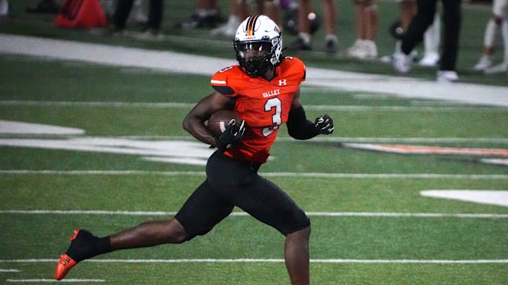 West Des Moines Valley senior wide receiver Zay Robinson runs the ball in for a touchdown against Waukee during a Class 5A football game at Valley Stadium in West Des Moines on Friday, Sept. 20, 2024.